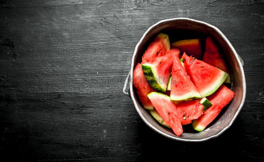 Similar – Image, Stock Photo Tasty strawberries in black colander bowl on dark rustic kitchen table. Copy space. Seasonal organic food. Healthy eating and cooking