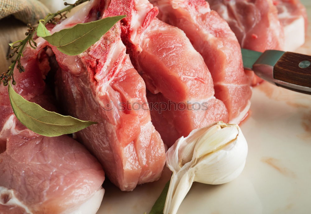 Similar – Image, Stock Photo Lamb cutlet with oil and rosemary