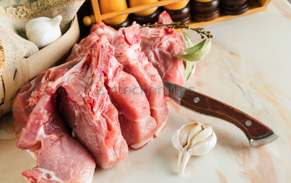 Similar – Image, Stock Photo Lamb cutlet with oil and rosemary