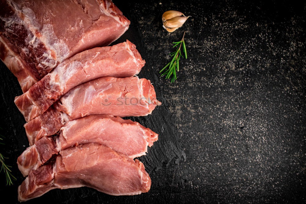 Similar – Image, Stock Photo Lamb Racks on kitchen table with green ingredients