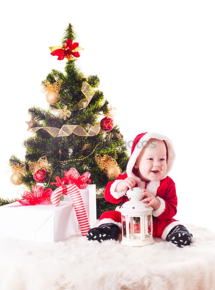 Similar – Image, Stock Photo Young girl decorating Christmas tree with lights at home