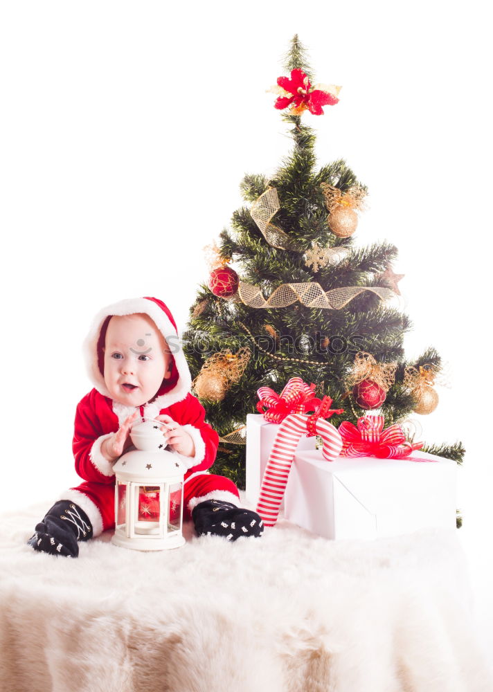 Similar – Image, Stock Photo Young girl decorating Christmas tree with lights at home