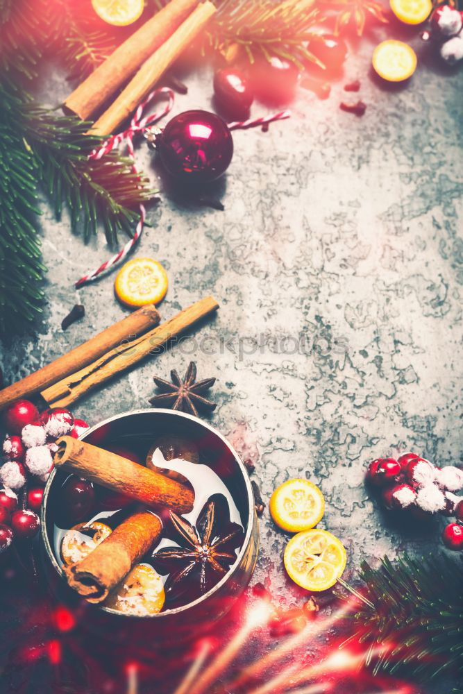 Similar – Christmas background with mulled wine and spices