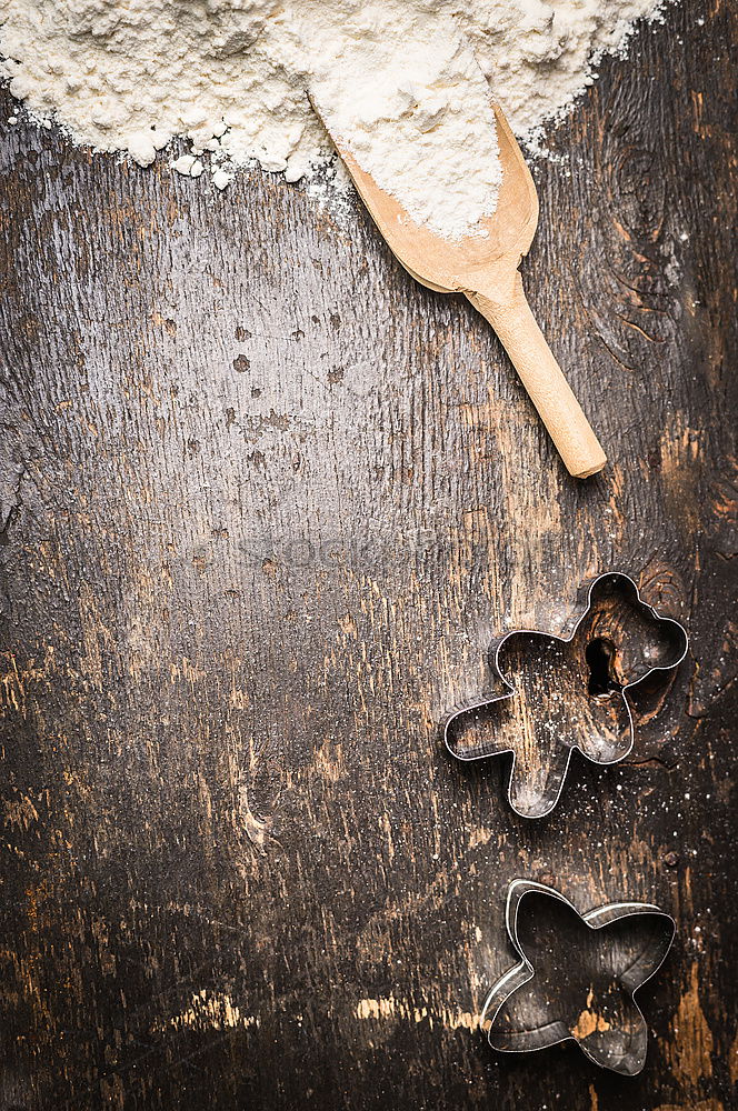 Similar – Cooking Christmas cookies with cookie cutters on a dark table