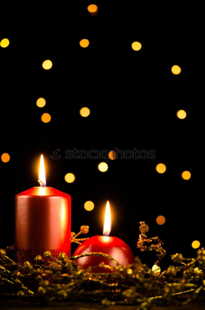 Similar – Advent arrangement with four candles. In the background the blurred lights of the Christmas tree.