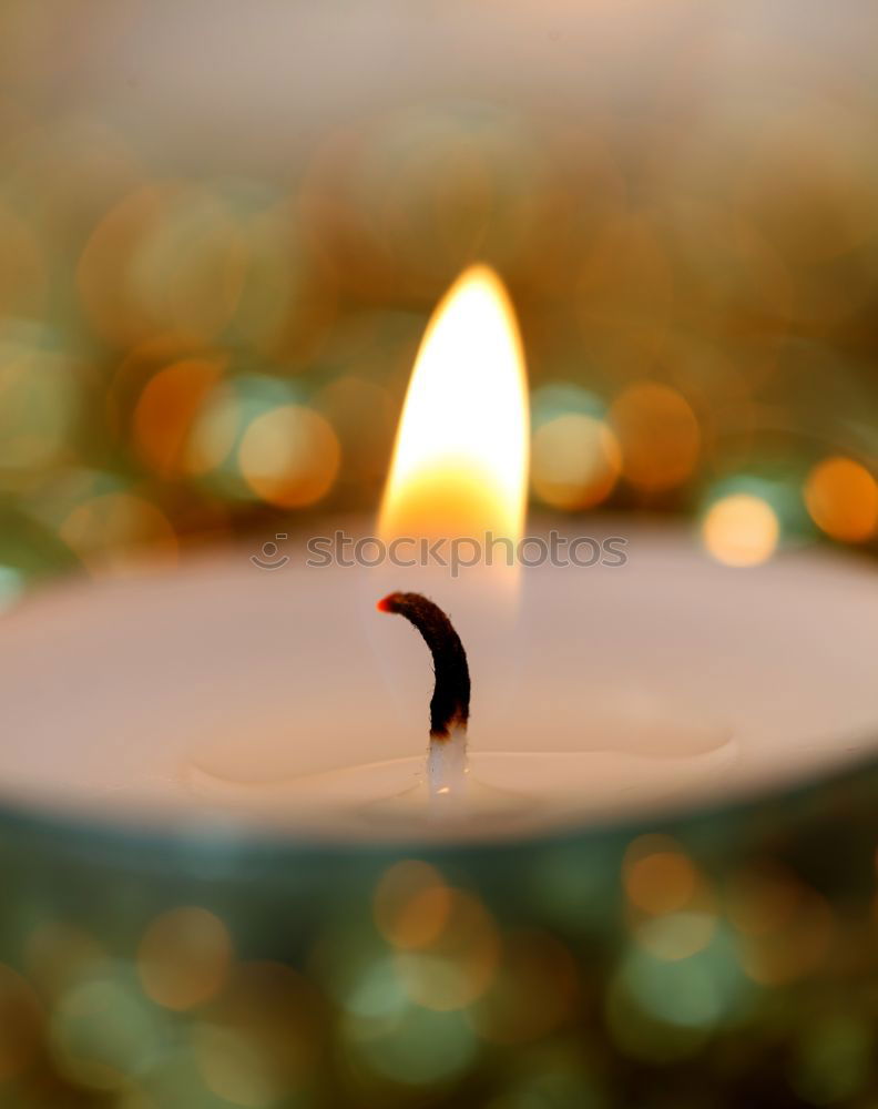 Similar – Image, Stock Photo Burning candle in a candle glass on a light wooden background. Weak depth of field