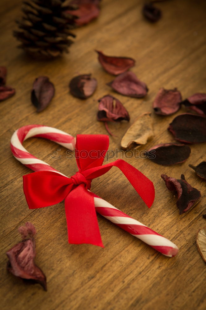 Image, Stock Photo Surprise l colorful Christmas parcels packed with Christmas paper with red bow, lying on rustic wood. Christmas presents, lie nicely decorated with ribbon on wooden table. Many Christmas parcels packed with wrapping paper with Christmas motif.