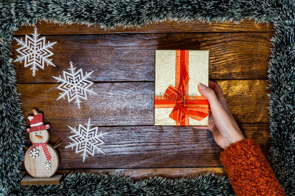 Similar – Woman arms doing christmas decoration in a wood table outdoors