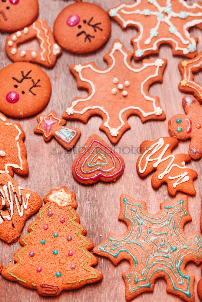 Image, Stock Photo Christmas cookies decorated with frosting on wooden board