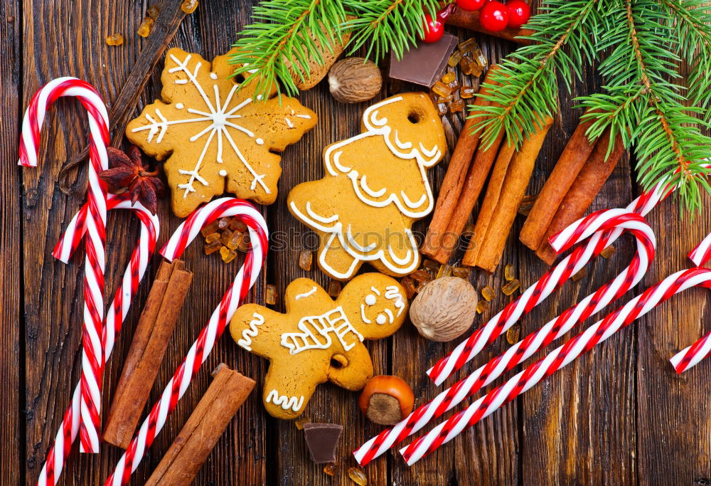 Similar – Gingerbread man with mulled wine, Christmas decoration and cookies