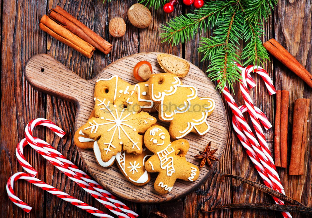 Similar – Gingerbread man with mulled wine, Christmas decoration and cookies