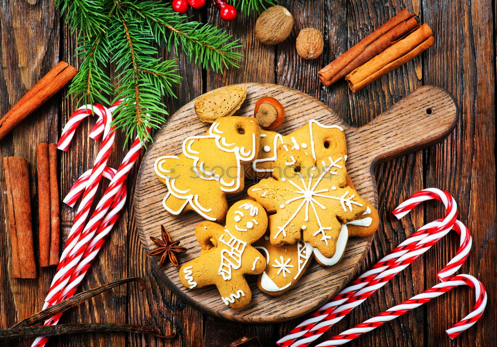 Similar – Gingerbread man with mulled wine, Christmas decoration and cookies