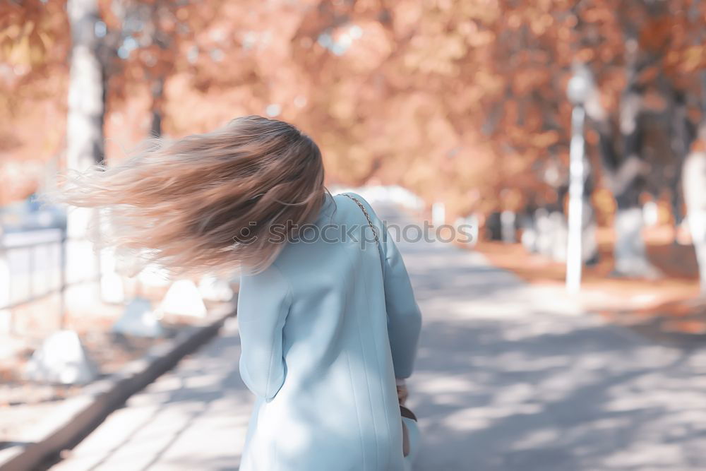 Similar – Young woman on a swing on a playground