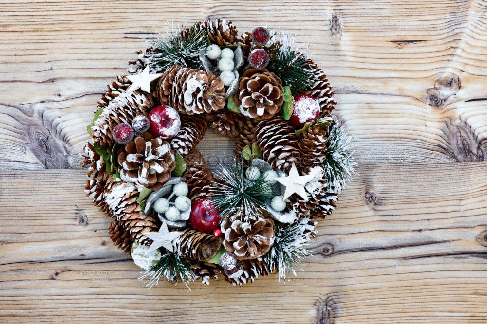 Similar – Delicate Christmas wreath of pine cones on wooden background