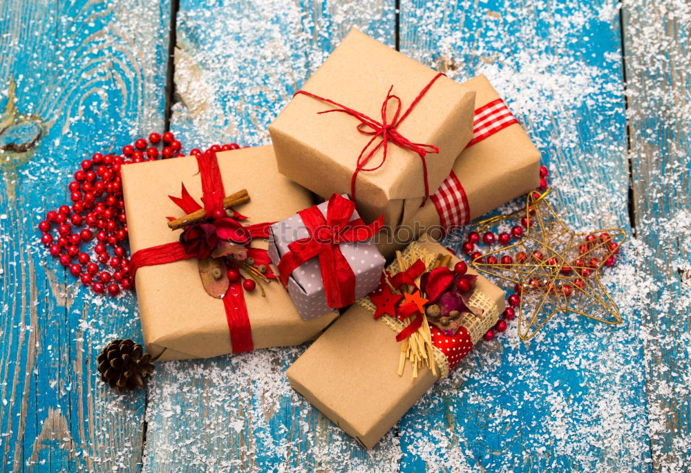 Similar – Some christmas presents in decorative boxes on a dark background