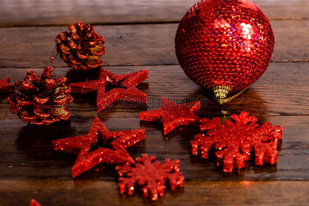 Similar – Lighted candles with red colored pearls around