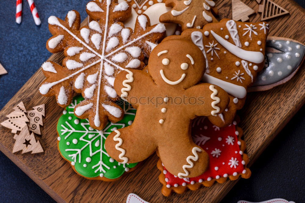 Similar – Image, Stock Photo Christmas cookies decorated with frosting on wooden board