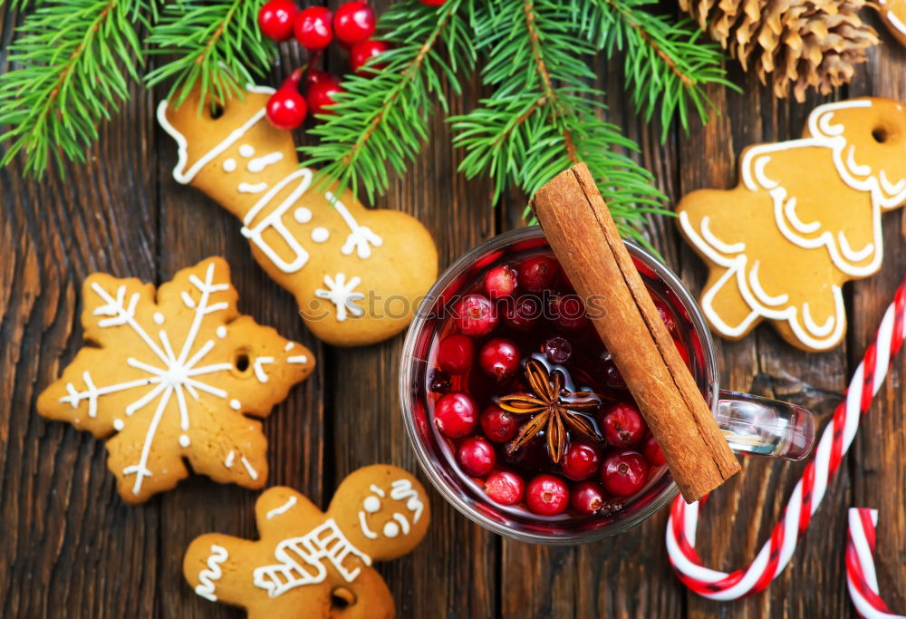 Similar – Gingerbread man with mulled wine, Christmas decoration and cookies