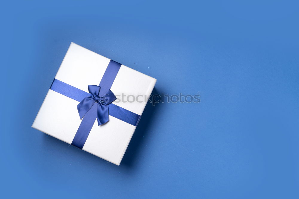 Similar – Image, Stock Photo gift box wrapped in kraft paper tied with ribbon