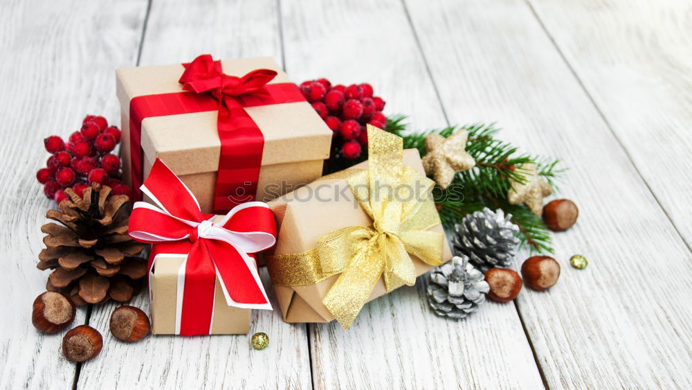 Similar – Gift box wrapped in recycled paper, red bow and tag