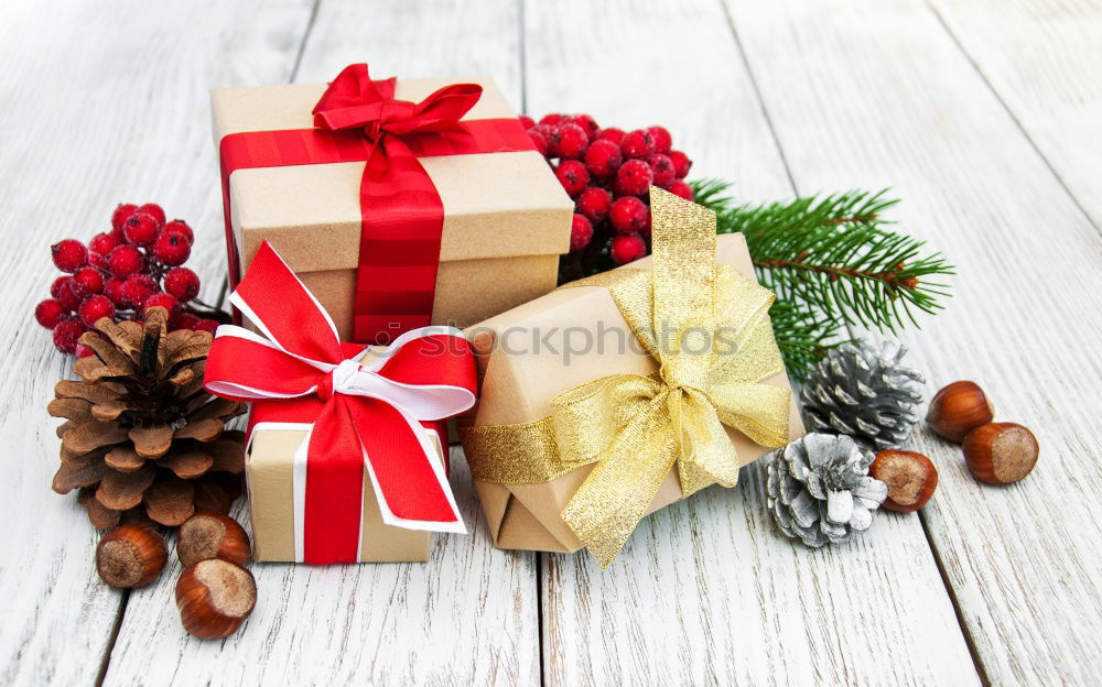 Similar – Gift box wrapped in recycled paper, red bow and tag