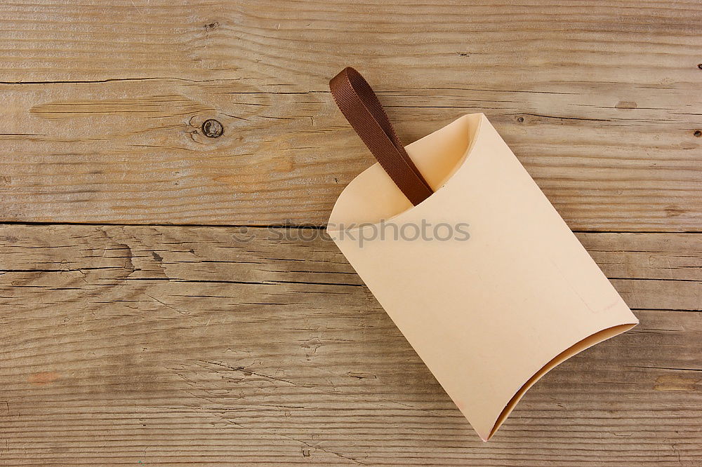 Similar – Paper diary in brown leather cover on old vintage wooden table