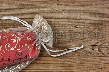 Similar – Image, Stock Photo colourful christmas parcels packed with christmas paper with red bow, on rustic wood. Christmas presents, lie nicely decorated with ribbon on wooden table. Many Christmas parcels wrapped with wrapping paper with Christmas motif. Concept gifts Advent.