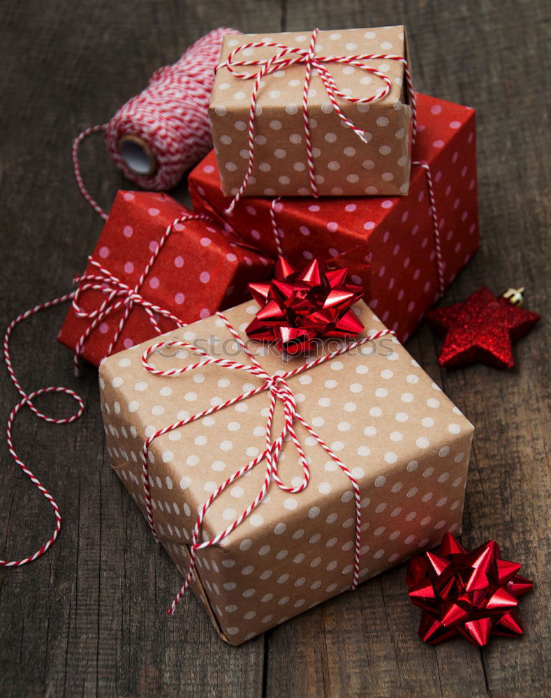 Similar – Image, Stock Photo colourful christmas parcels packed with christmas paper with red bow, on rustic wood. Christmas presents, lie nicely decorated with ribbon on wooden table. Many Christmas parcels wrapped with wrapping paper with Christmas motif. Concept gifts Advent.