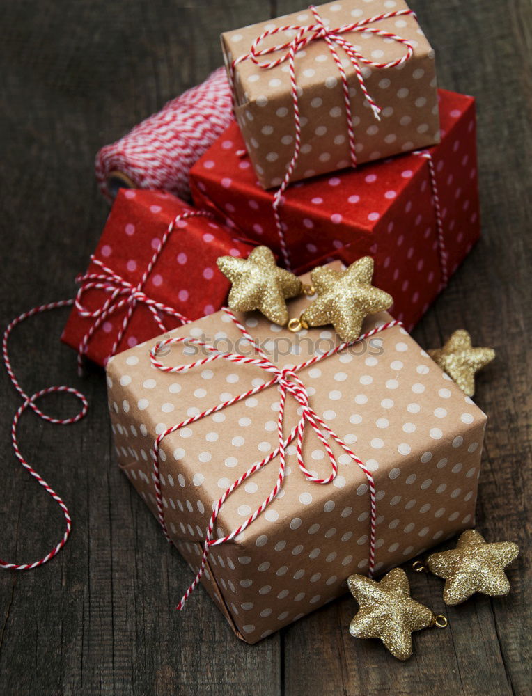 Image, Stock Photo Christmas parcel with red bow on wooden background.