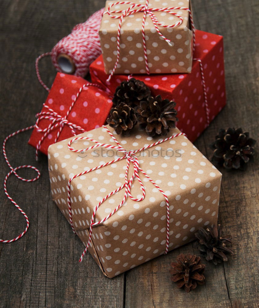 Image, Stock Photo colourful christmas parcels packed with christmas paper with red bow, on rustic wood. Christmas presents, lie nicely decorated with ribbon on wooden table. Many Christmas parcels wrapped with wrapping paper with Christmas motif. Concept gifts Advent.