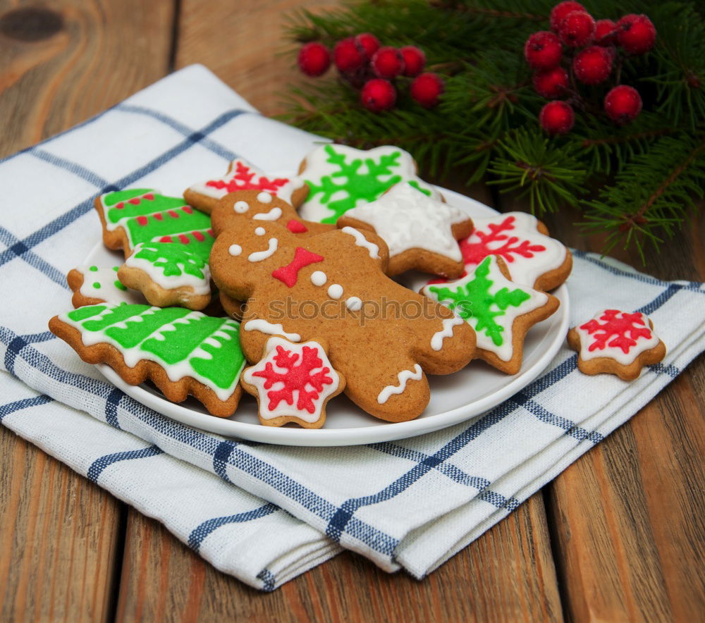 Similar – Christmas cookies on a dish with a wooden table background