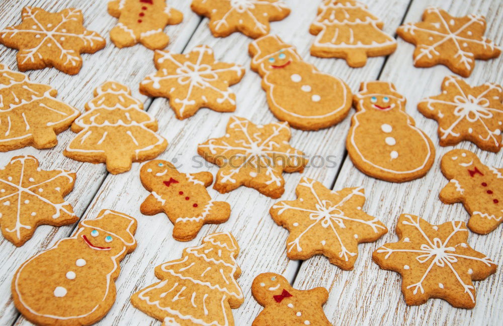 Similar – Image, Stock Photo Christmas cookies decorated with frosting on wooden board