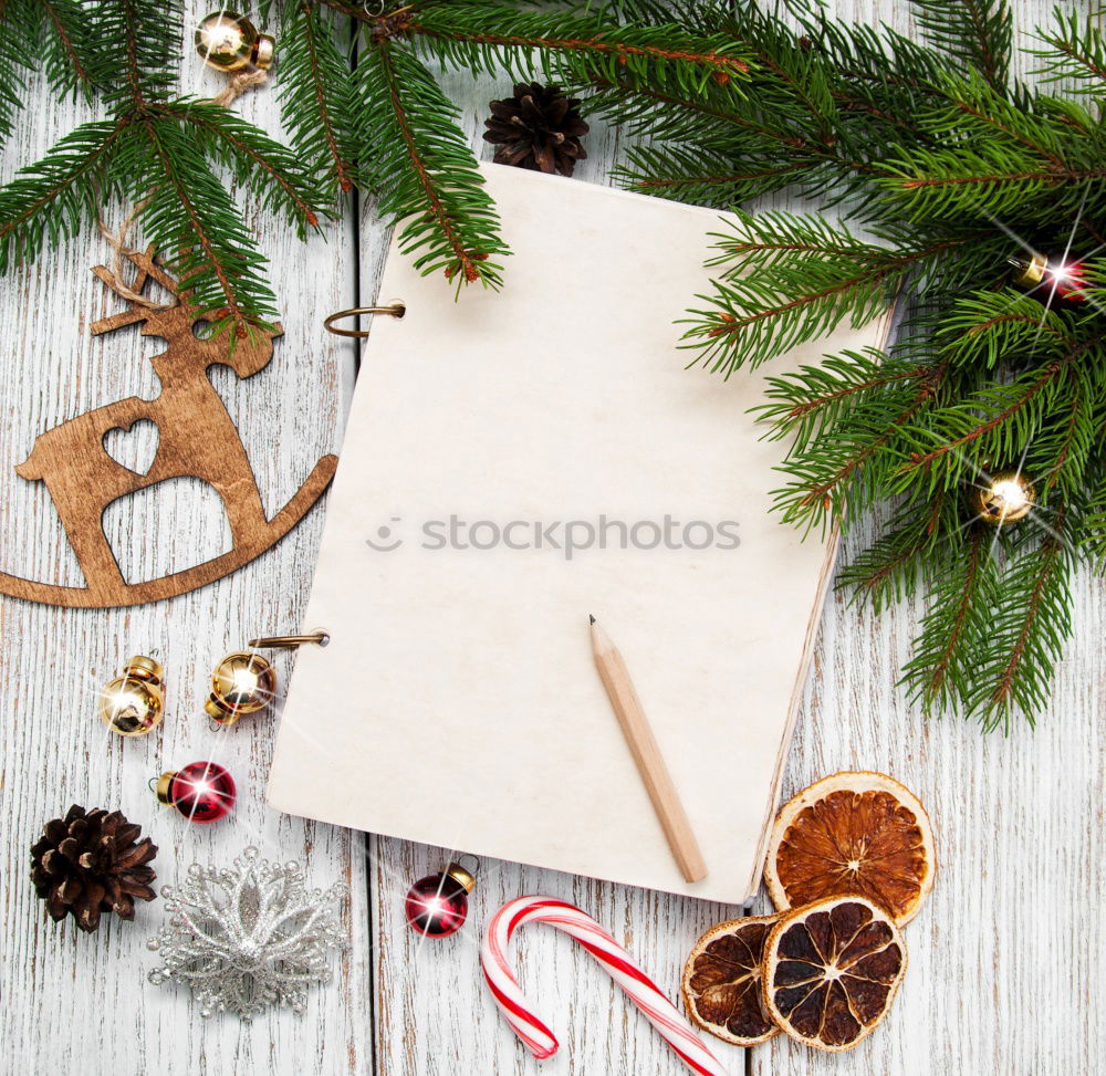 Similar – Notebook on a winterly decorated Christmas table