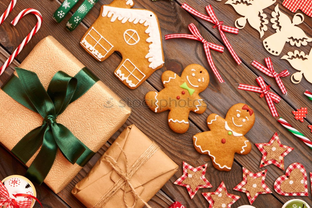 Similar – Image, Stock Photo Female hands tying baked Christmas gingerbread with ribbon