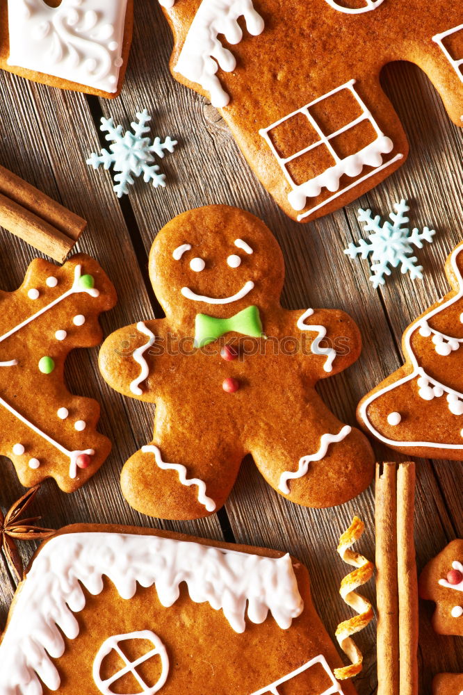 Similar – Image, Stock Photo Christmas cookies decorated with frosting on wooden board