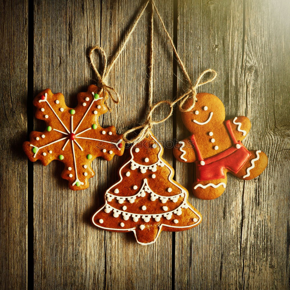 Similar – Image, Stock Photo Yellow cookies lying on the table with Christmas tree and gifts