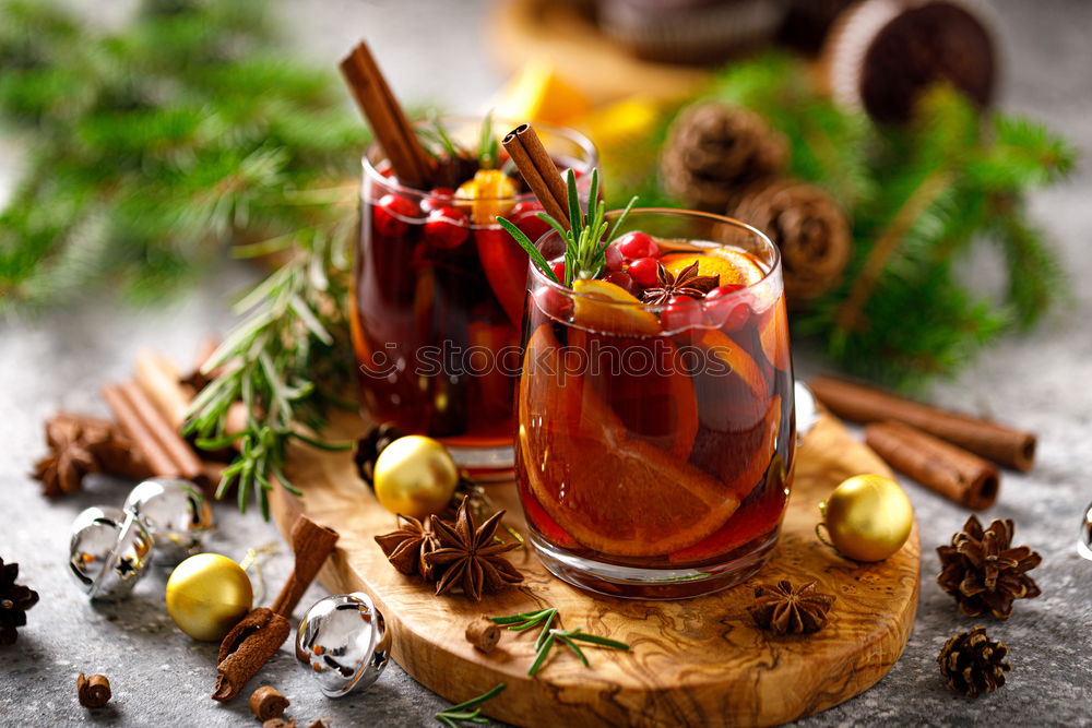 Similar – Mulled wine with dried fruits on winter decoration