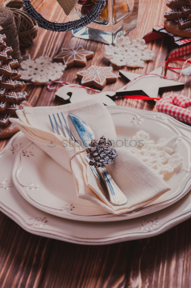 Similar – Christmas table set with biscuits and candles