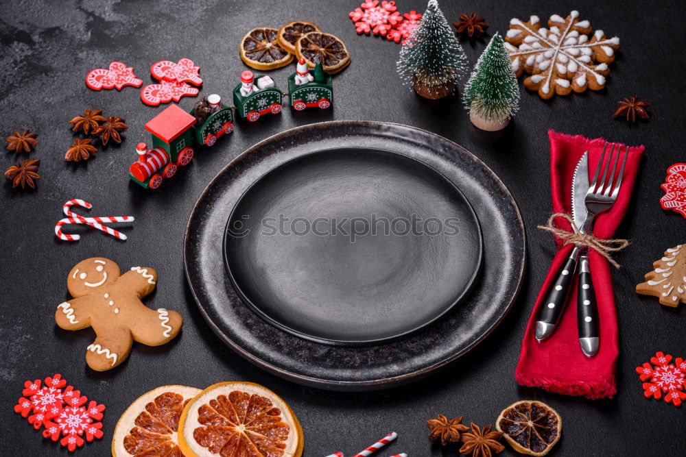 Similar – Mulled wine with spices, cookies and gingerbread man