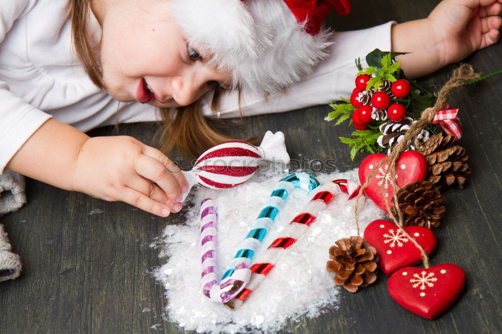 Similar – Image, Stock Photo Mother and son decorating Christmas biscuits at home