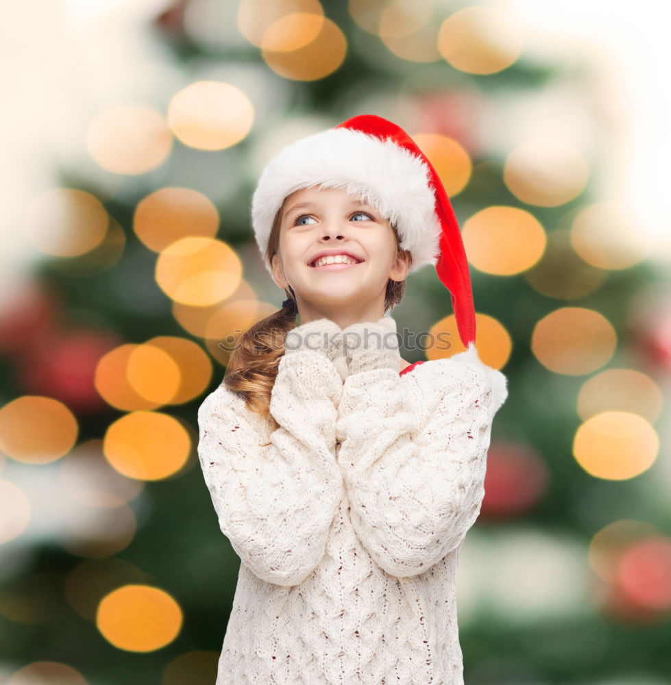 Similar – Image, Stock Photo Young girl decorating Christmas tree with lights at home