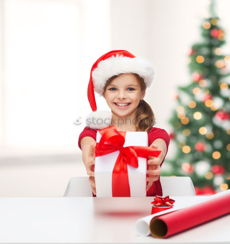 Similar – Adorable kid with Santa´s hat on Christmas day.