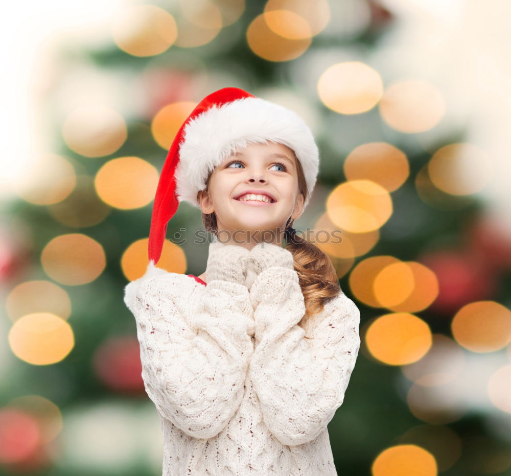 Similar – Image, Stock Photo Young girl decorating Christmas tree with lights at home