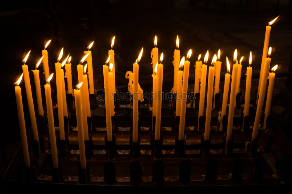 Similar – Lit beeswax candles in sand; Orthodox church