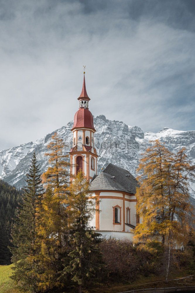 Similar – Church tower in front of foggy landscape