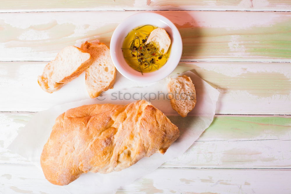 Image, Stock Photo Baguette with olives, garlic and cheese