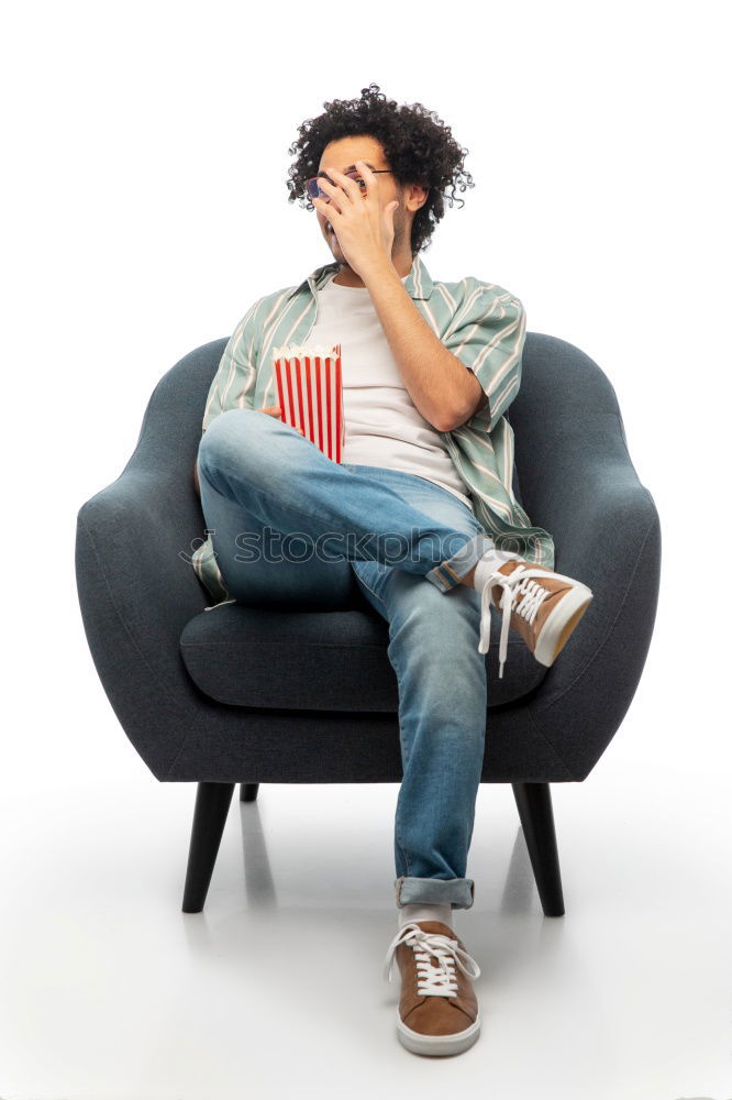 Similar – Portrait of a young thoughtful mixed race man sitting in the sofa