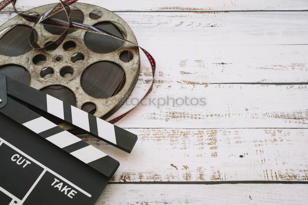 Similar – popcorn and clapboard on yellow background. Cinema concept