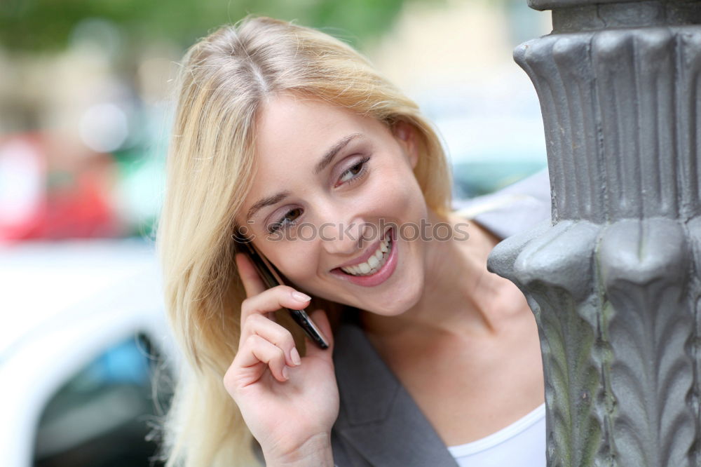 Similar – Attractive blond woman checking her mobile phone