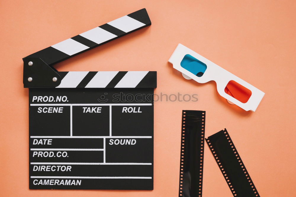 Similar – popcorn and clapboard on yellow background. Cinema concept